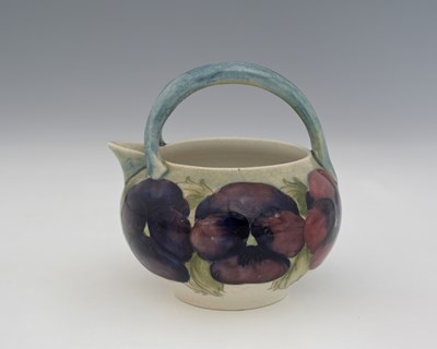 Lot 525 - William Moorcroft, a Pansy on white mik jug,...