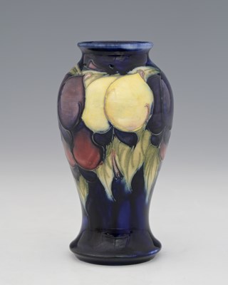 Lot 684 - William Moorcroft, a small Wisteria vase,...