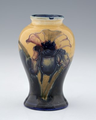 Lot 511 - William Moorcroft, a small Orchid on ochre...