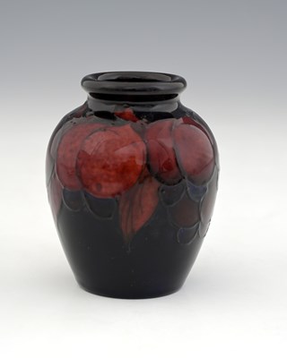 Lot 522 - William Moorcroft, a small Flambe Wisteria...