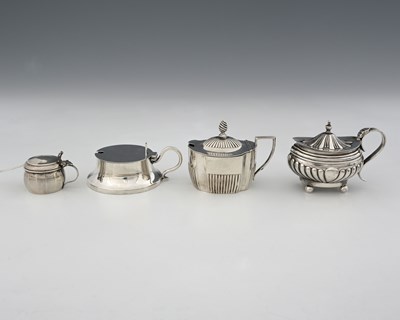 Lot 401 - Four hallmarked silver mustard pots, to...