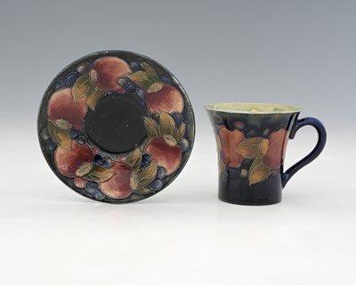Lot 518 - William Moorcroft, a Pomegranate coffee cup...