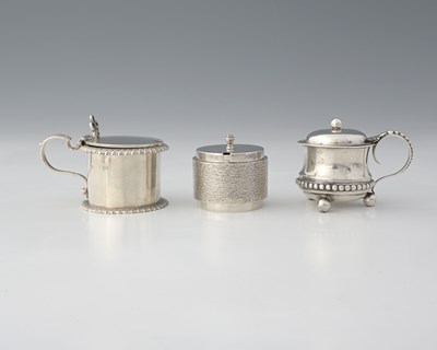Lot 73 - Three hallmarked silver mustard pots, to...