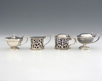 Lot 320 - Four hallmarked silver mustard pots, to...
