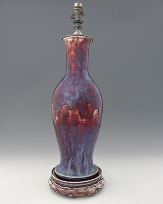 Lot 634 - Ruskin Pottery, a High Fired lamp base on...