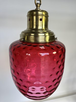 Lot 700 - A brushed-brass mounted raspberry glass...