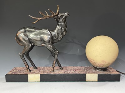 Lot 613 - An Art Deco style table lamp formed as a cast...