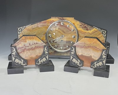 Lot 263 - A French Art Deco mantle clock and garniture...