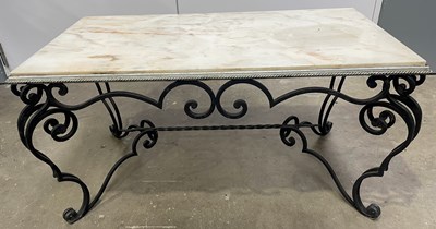 Lot 523 - A marble topped wrought iron coffee table with...