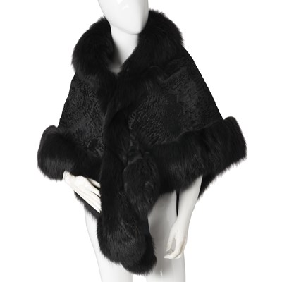 Lot 563 - A Karikul shawl with fox fur trim.