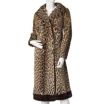 Lot 548 - Fabian Furs of Mayfair, an ocelot fur coat w/ mink fur trim.