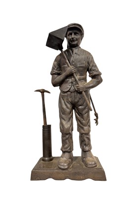 Lot 186 - A Novelty cast iron fire companion modelled as...