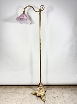 Lot 548 - A brass standard lamp, a decorative triform...