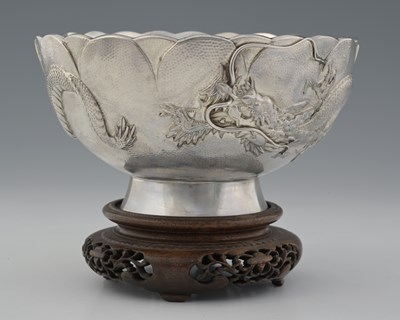 Lot 35 - Japan, a Meiji period silver dragon bowl on...
