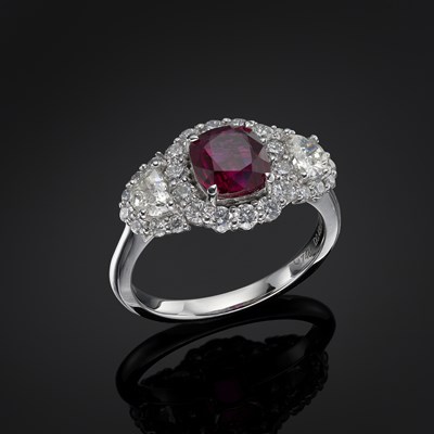 Lot 200 - A platinum ruby and diamond cluster dress ring
