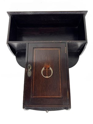 Lot 214 - An Arts & Crafts dark-stained oak wall hanging...