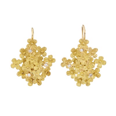 Lot 98 - A pair of high carat gold diamond floral earrings