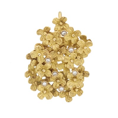 Lot 100 - A high carat gold diamond floral pendant