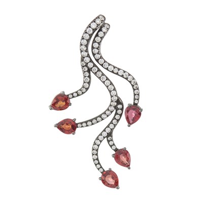 Lot 85 - An 18ct gold orange sapphire and diamond pendant