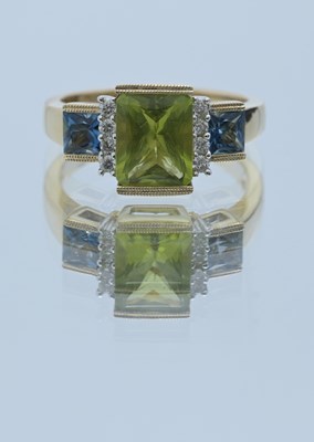 Lot 28 - A 14ct gold peridot, blue topaz and brilliant-cut diamond dress ring