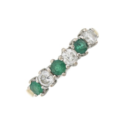 Lot 174 - An 18ct gold emerald and diamond six-stone ring