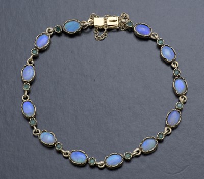 Lot 31 - A 9ct gold opal and emerald bracelet