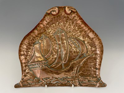 Lot 134 - An Arts and Crafts repousse embossed crumb...