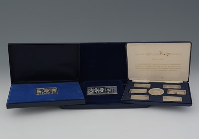 Lot 226 - Three cased commemorative silver sets, to...