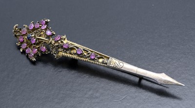 Lot 12 - A Continental gilt metal and sapphire set...