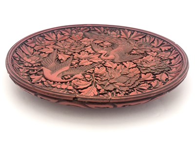 Lot 624 - A Cinnabar carved lacquer circular charger,...