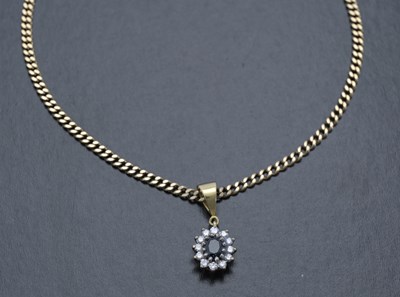 Lot 45 - An 18ct gold sapphire and diamond cluster pendant, with 9ct gold chain