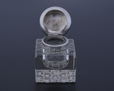 Lot 121 - An Edwardian silver and glass inkwell, Nathan...