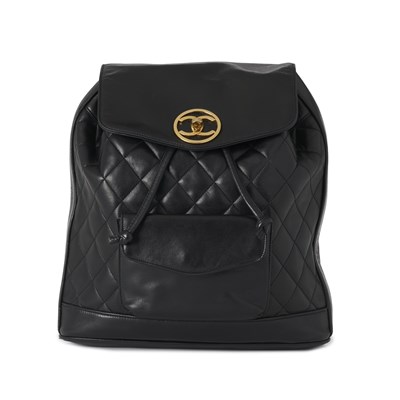 Lot 315 - Chanel, a vintage black quilted backpack w/ pouch.