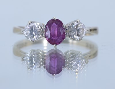 Lot 5 - A 9ct gold gem set ring, the central pink...