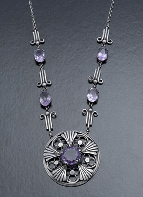 Lot 93 - A large Mexican style white metal and amethyst...