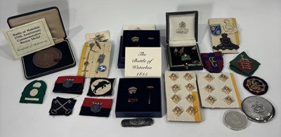 Lot 218 - A selection of military brooches, badges, coins etc