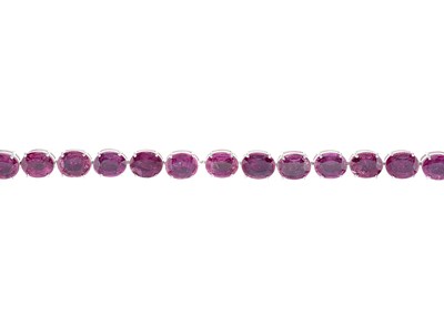 Lot 62 - An 18ct gold glass-filled ruby line bracelet