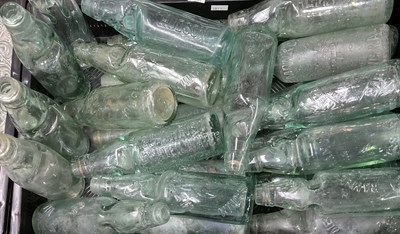 Lot 41 - A large collection of green codd-neck glass...