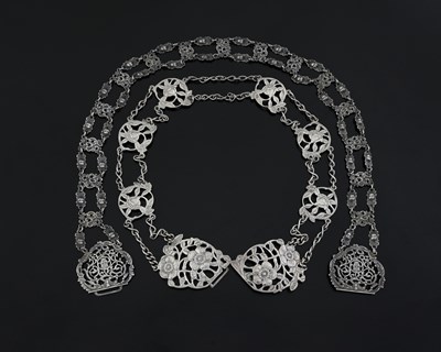 Lot 348 - Two Edwardian silver belts, to include a cast...