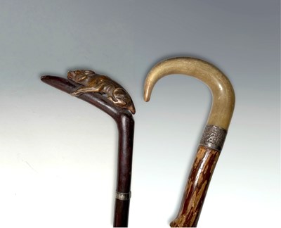 Lot 65 - Two wooden walking sticks with silver collars,...