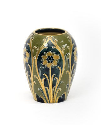 Lot 10 - 'Green and Gold Florian Ware' a small James...