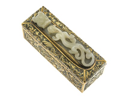 Lot 469 - A Chinese carved jade belt hook set into a...