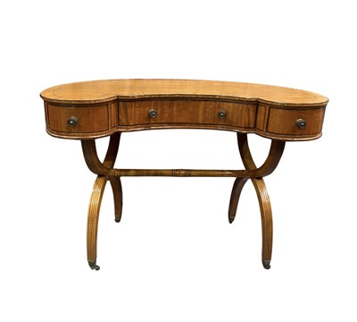 Lot 384 - A reproduction Regency style kidney shaped...