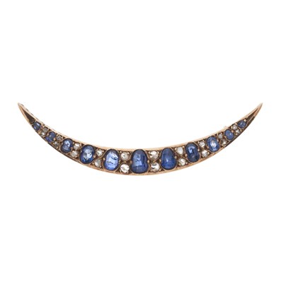 Lot 8 - An early 20th century gold sapphire and diamond crescent brooch