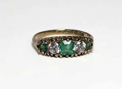 Lot 243 - An 18ct gold emerald and cubic zirconia five-stone ring
