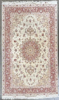 Lot 345 - A large 20th century Tabriz carpet or rug,...