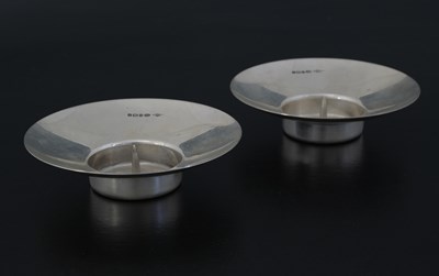 Lot 127 - Two contemporary silver candle holders,...