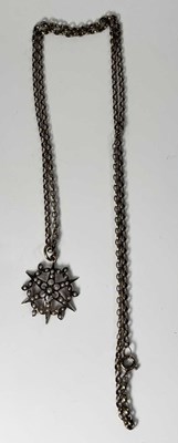 Lot 240 - A 9ct gold pearl set star pendant on 9ct gold...