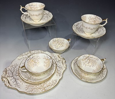 Lot 98 - Five Rockingham gilt seaweed pattern teacups...