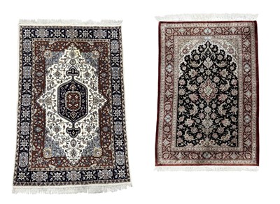 Lot 347 - A Persian style silk rug, possibly Kashmiri,...